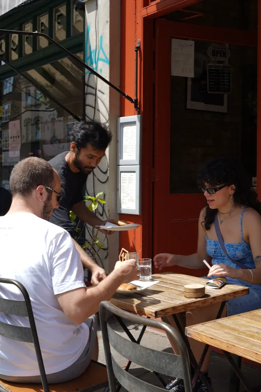 Guests having coffee at an outdoor table